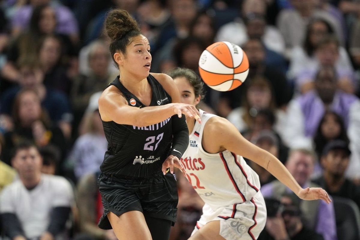 Jul 18, 2026; San Francisco, California, USA; Golden State Valkyries guard Veronica Burton (left) passes against Washington Mystics guard Sonia Citron (right) during the fourth quarter at Chase Center. Mandatory Credit: Darren Yamashita-Imagn Images