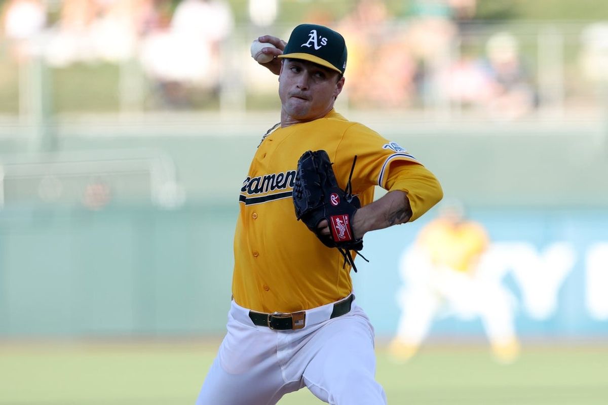 Jul 18, 2026; West Sacramento, California, USA; Athletics starting pitcher J.T. Ginn (35) throws a pitch against the Washington Nationals during the first inning at Sutter Health Park. Mandatory Credit: Dennis Lee-Imagn Images