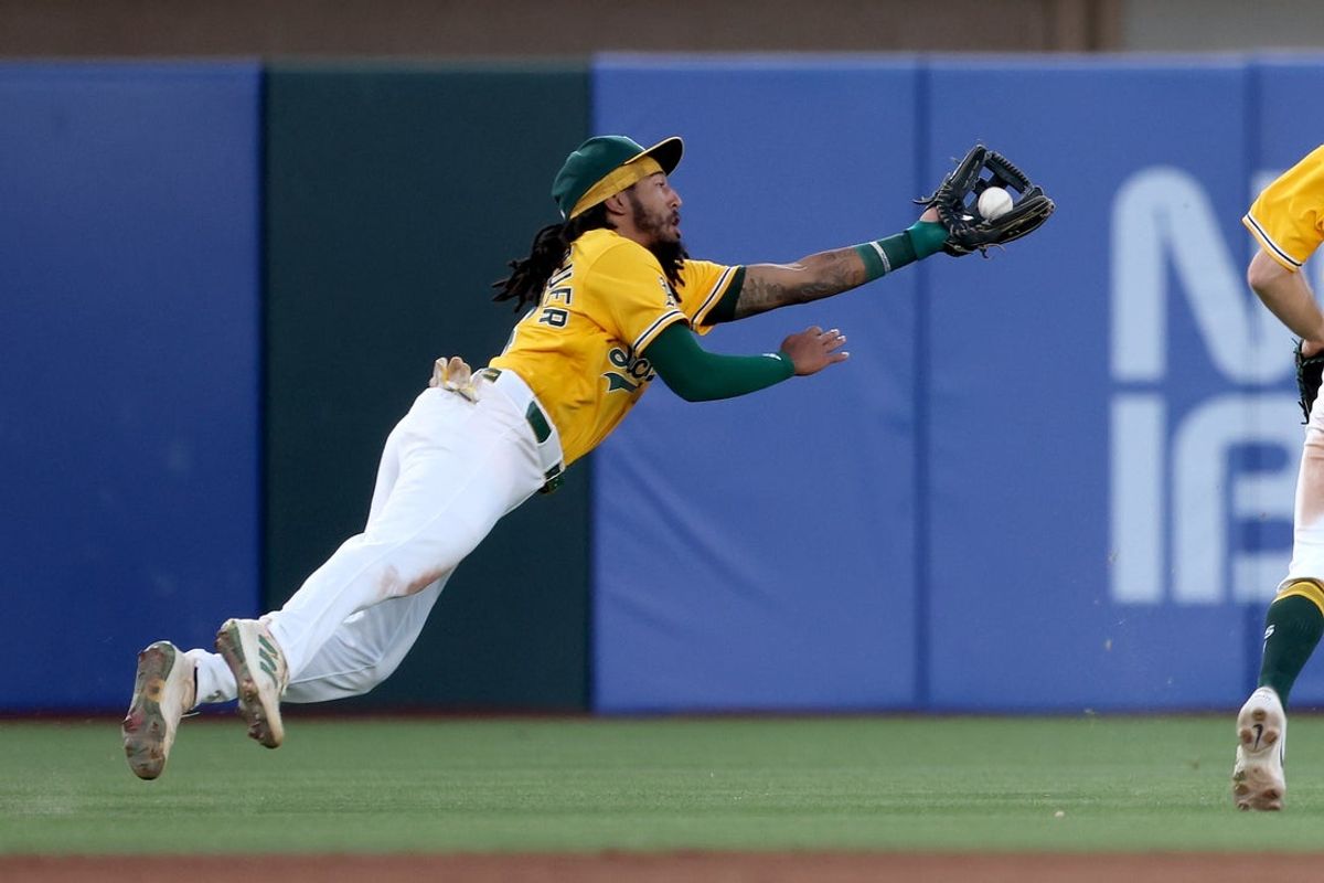 Jul 18, 2026; West Sacramento, California, USA; Athletics third baseman Joshua Kuroda-Grauer (44) makes a diving catch against the Washington Nationals during the fourth inning at Sutter Health Park. Mandatory Credit: Dennis Lee-Imagn Images