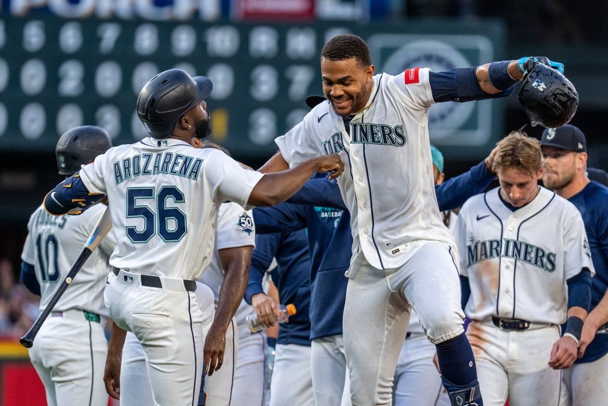 Jul 18, 2026; Seattle, Washington, USA;  Seattle Mariners designated hitter Julio Rodriguez (44) and left fielder Randy Arozarena (56) celebrate after a game against the San Francisco Giants at T-Mobile Park. Mandatory Credit: Stephen Brashear-Imagn Images