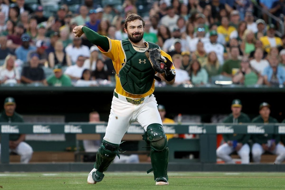 Jul 18, 2026; West Sacramento, California, USA; Athletics catcher Shea Langeliers (23) throws to first base for an out against the Washington Nationals during the fifth inning at Sutter Health Park. Mandatory Credit: Dennis Lee-Imagn Images