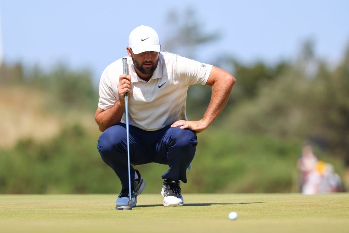 Jul 19, 2026; Southport, ENG; Scottie Scheffler lines up a putt on the ninth green during the final round of The Open Championship golf tournament at Royal Birkdale. Mandatory Credit: Bill Streicher-Imagn Images