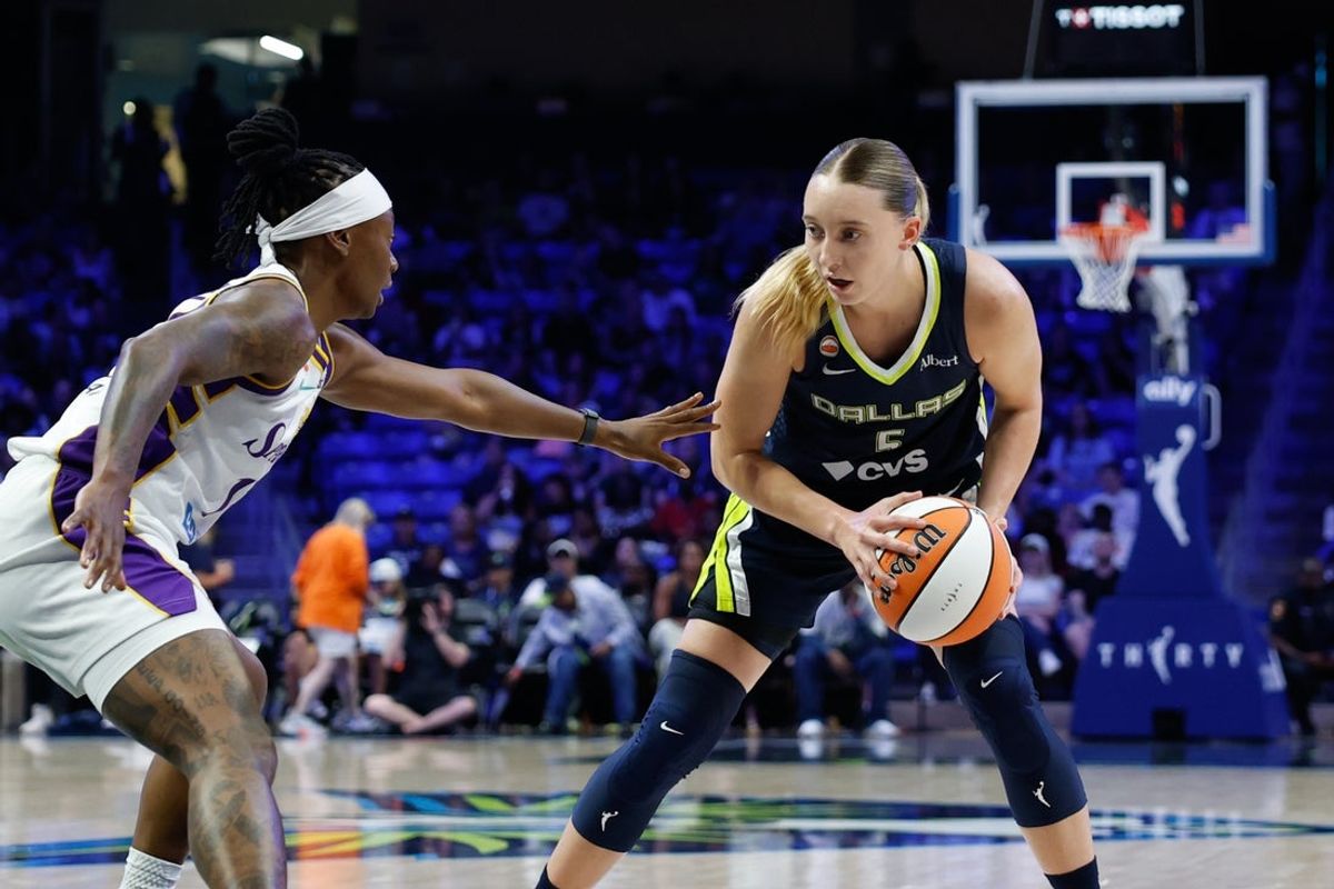 Jul 19, 2026; Arlington, Texas, USA;  Dallas Wings guard Paige Bueckers (5) controls the ball as Los Angeles Sparks guard Erica Wheeler (17) defends during the first half at College Park Center. Mandatory Credit: Chris Jones-Imagn Images