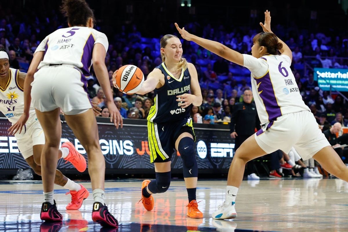 Jul 19, 2026; Arlington, Texas, USA;  Dallas Wings guard Paige Bueckers (5) looks to pass as Los Angeles Sparks guard Jihyun Park (6) defends during the first half at College Park Center. Mandatory Credit: Chris Jones-Imagn Images