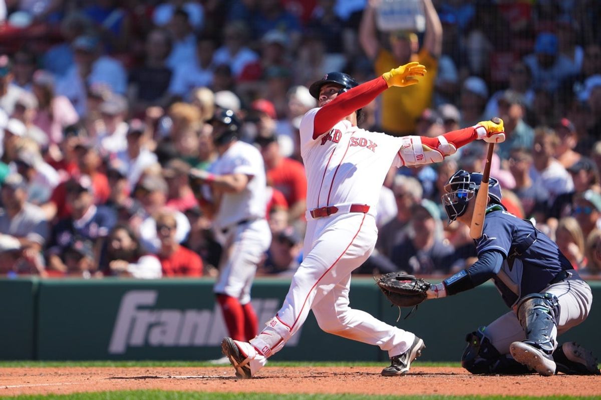 Jul 19, 2026; Boston, Massachusetts, USA; Boston Red Sox first baseman Wilson Contreras (40) hits a two run home run against the Tampa Bay Rays during the fifth inning at Fenway Park. Mandatory Credit: Gregory Fisher-Imagn Images