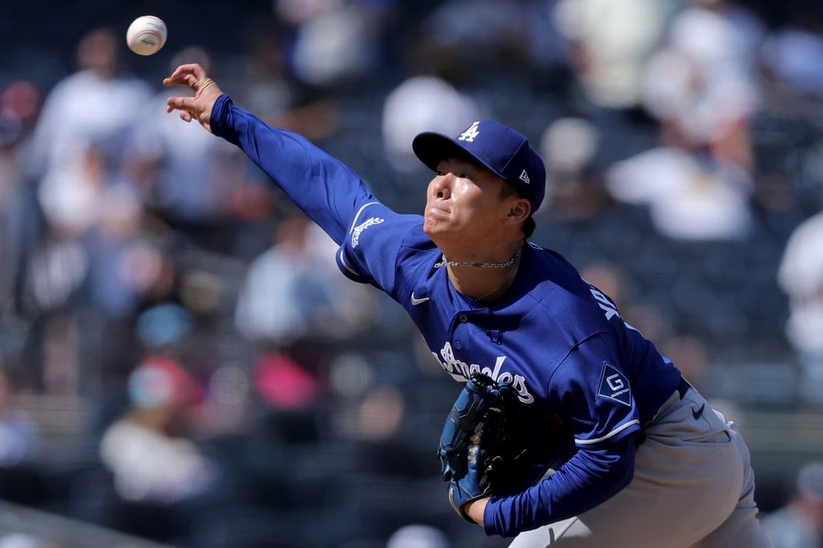 Jul 19, 2026; Bronx, New York, USA; Los Angeles Dodgers starting pitcher Yoshinobu Yamamoto (18) pitches against the New York Yankees during the ninth inning at Yankee Stadium. Mandatory Credit: Brad Penner-Imagn Images