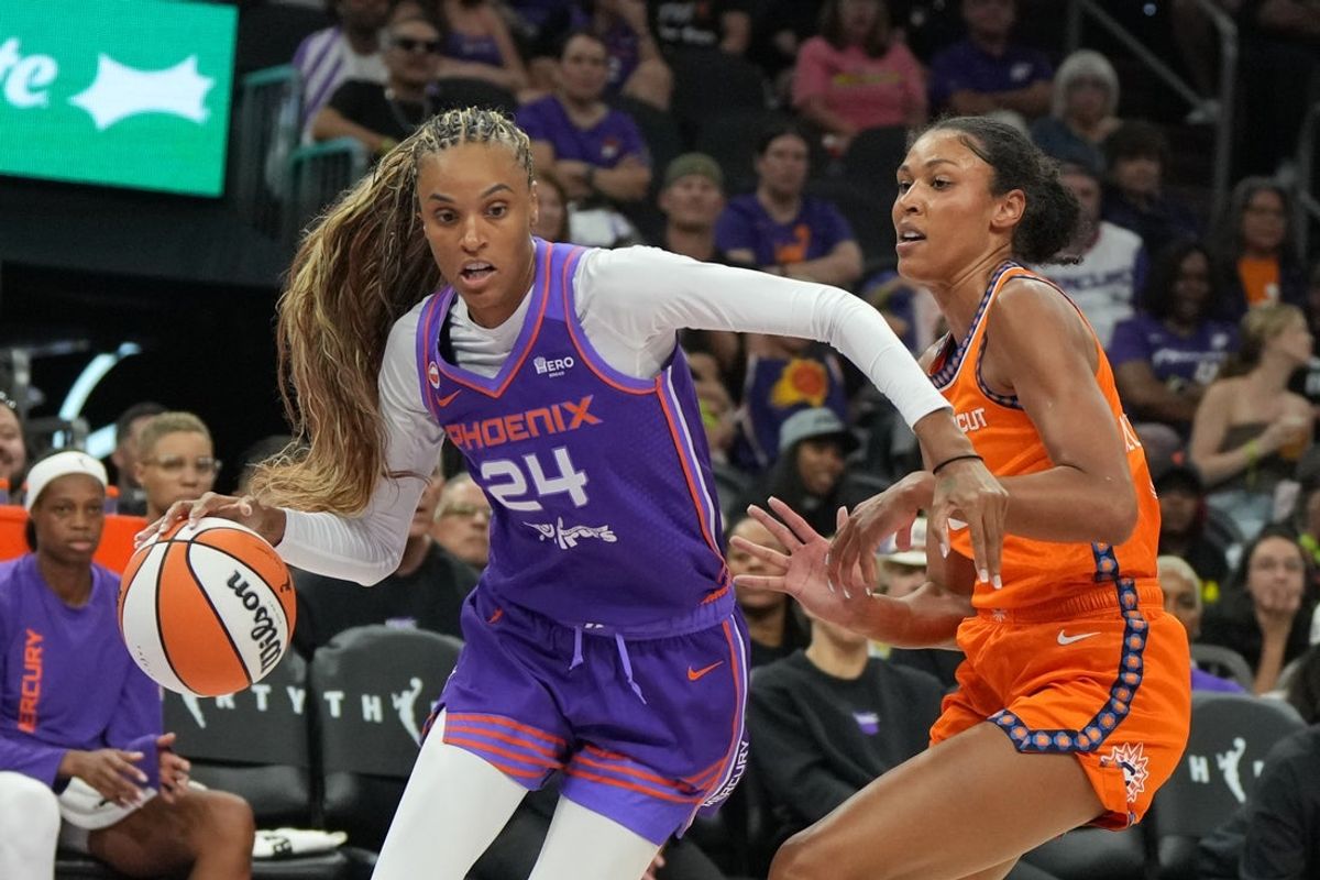 Jul 19, 2026; Phoenix, Arizona, USA; Phoenix Mercury forward-guard DeWanna Bonner (24) drives against Connecticut Sun center Olivia Nelson-Ododa (10) in the first half at Mortgage Matchup Center. Mandatory Credit: Rick Scuteri-Imagn Images