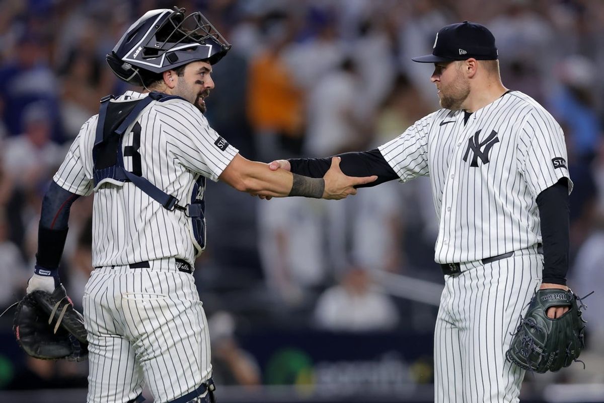 Jul 19, 2026; Bronx, New York, USA; New York Yankees catcher Austin Wells (28) and relief pitcher David Bednar (53) celebrate after defeating the Los Angeles Dodgers at Yankee Stadium. Mandatory Credit: Brad Penner-Imagn Images