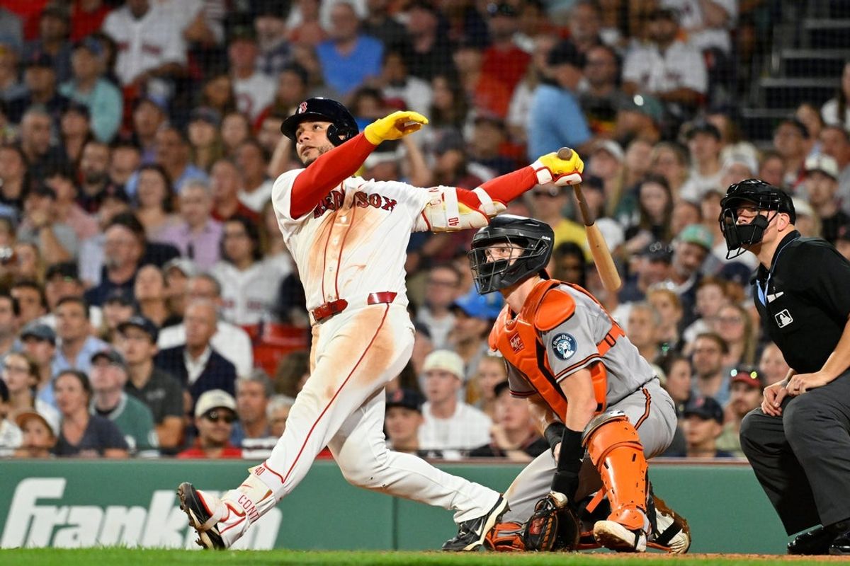 Jul 20, 2026; Boston, Massachusetts, USA; Boston Red Sox first baseman Willson Contreras (40) hits a one run RBI double against the Baltimore Orioles during the sixth inning at Fenway Park. Mandatory Credit: Eric Canha-Imagn Images