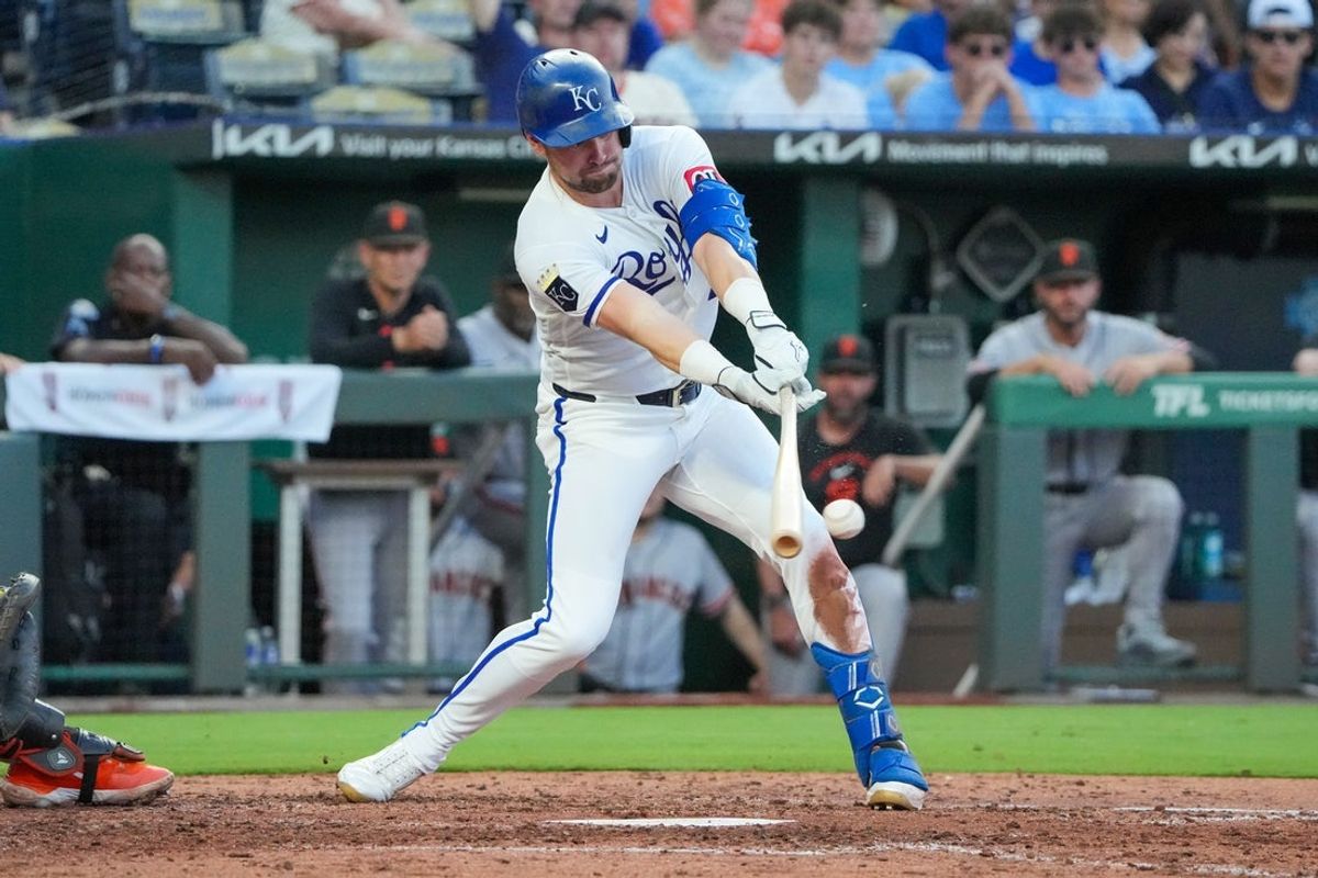 Jul 20, 2026; Kansas City, Missouri, USA; Kansas City Royals center fielder Lane Thomas (15) hits a single against the San Francisco Giants during the sixth inning at Kauffman Stadium. Mandatory Credit: Denny Medley-Imagn Images