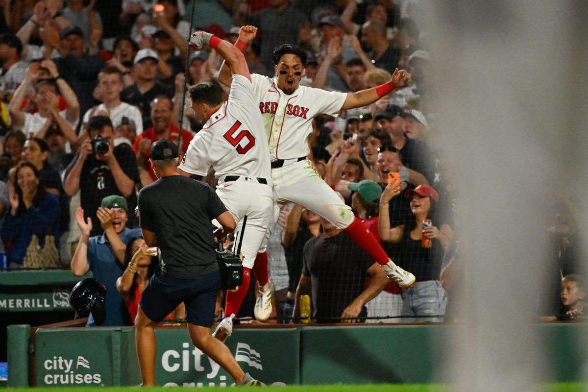 Jul 20, 2026; Boston, Massachusetts, USA; Boston Red Sox third baseman Caleb Durbin (5) celebrates his home run against the Baltimore Orioles with second baseman Anthony Seigler (48) during the eighth inning at Fenway Park. Mandatory Credit: Eric Canha-Imagn Images