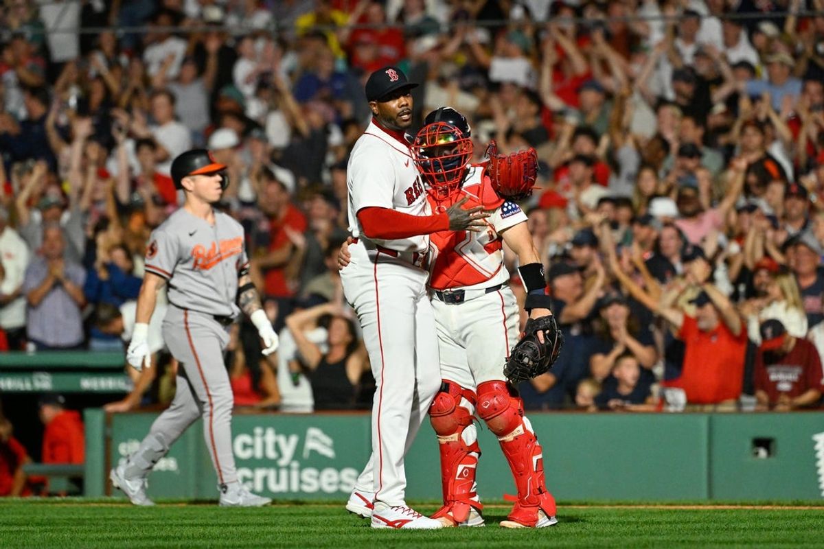 Jul 20, 2026; Boston, Massachusetts, USA; Boston Red Sox relief pitcher Aroldis Chapman (44) celebrates beating the Baltimore Orioles with catcher Connor Wong (12) at Fenway Park. Mandatory Credit: Eric Canha-Imagn Images