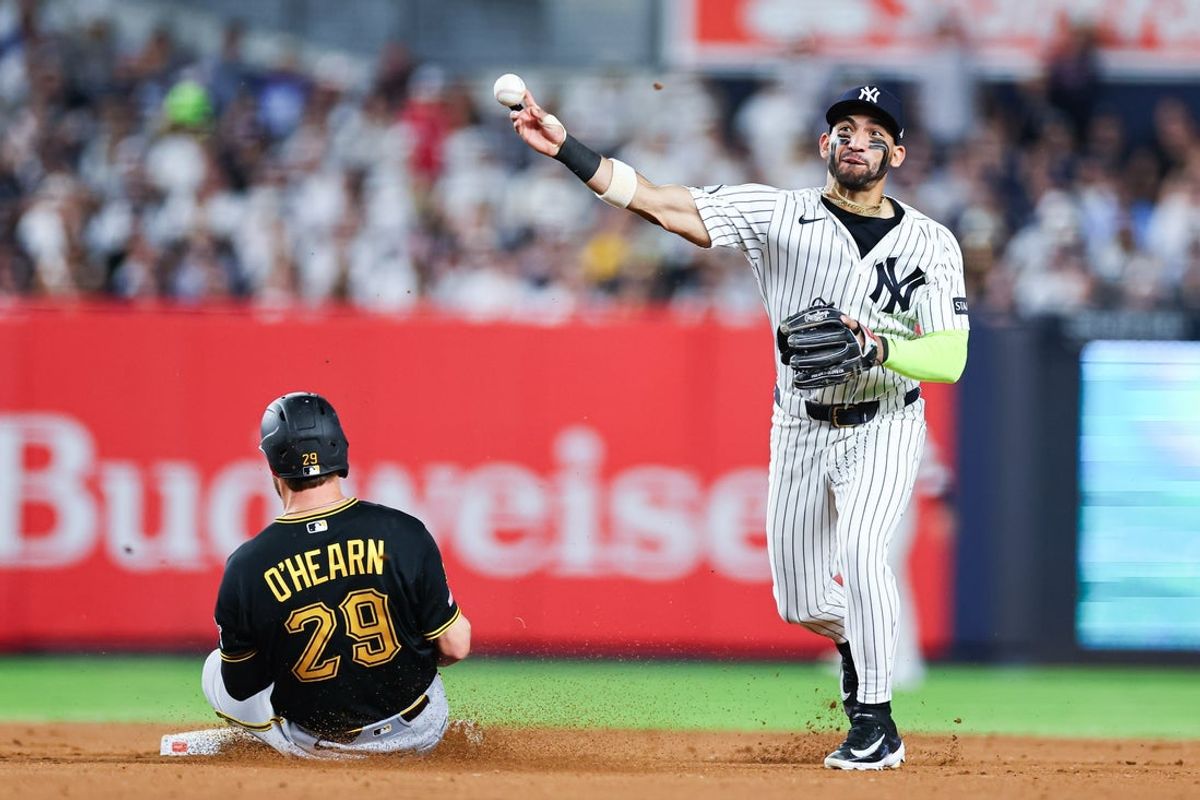 Jul 20, 2026; Bronx, New York, USA; New York Yankees shortstop Jose Caballero (72) forces out Pittsburgh Pirates right fielder Ryan O'Hearn (29) at second base and throws to first to complete the double play on a ball hit by designated hitter Marcell Ozuna (not pictured) during the eighth inning at Yankee Stadium. Mandatory Credit: Vincent Carchietta-Imagn Images