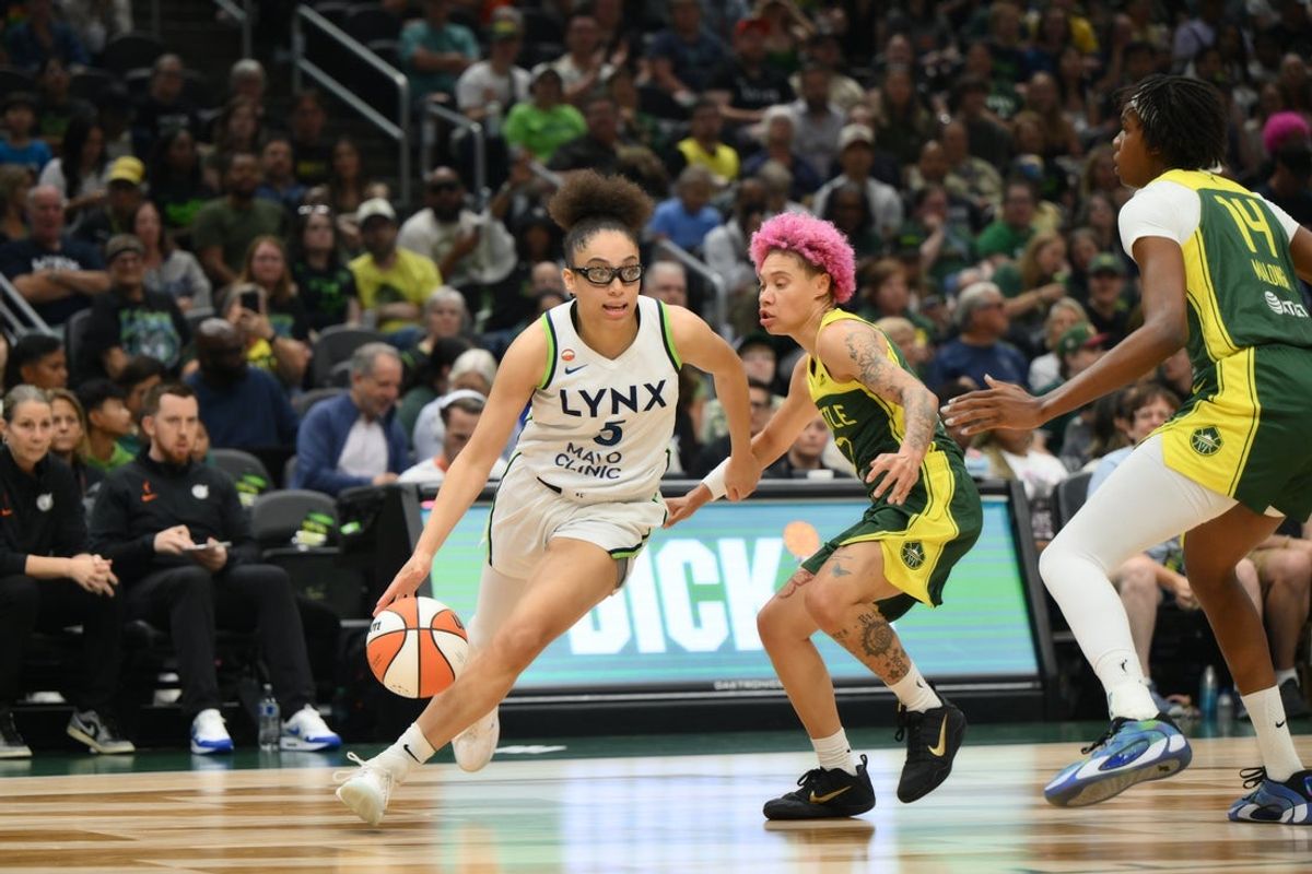 Jul 20, 2026; Seattle, Washington, USA; Minnesota Lynx guard Olivia Miles (5) dribbles the ball while guarded by Seattle Storm guard Natisha Hiedeman (2) during the first half at Climate Pledge Arena. Mandatory Credit: Steven Bisig-Imagn Images