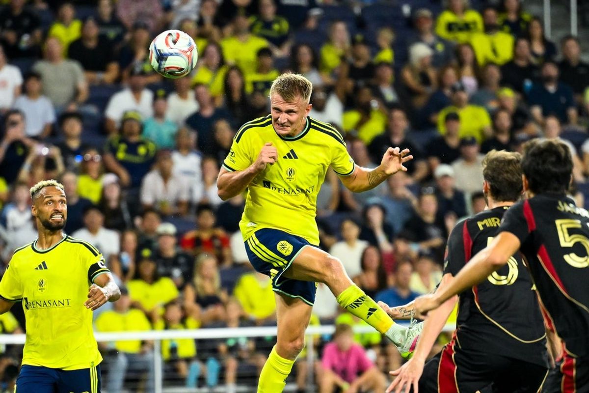 Jul 17, 2026; Nashville, Tennessee, USA;  Nashville SC forward Sam Surridge (9) heads the ball against the Atlanta United during the second half at Geodis Park. Mandatory Credit: Steve Roberts-Imagn Images