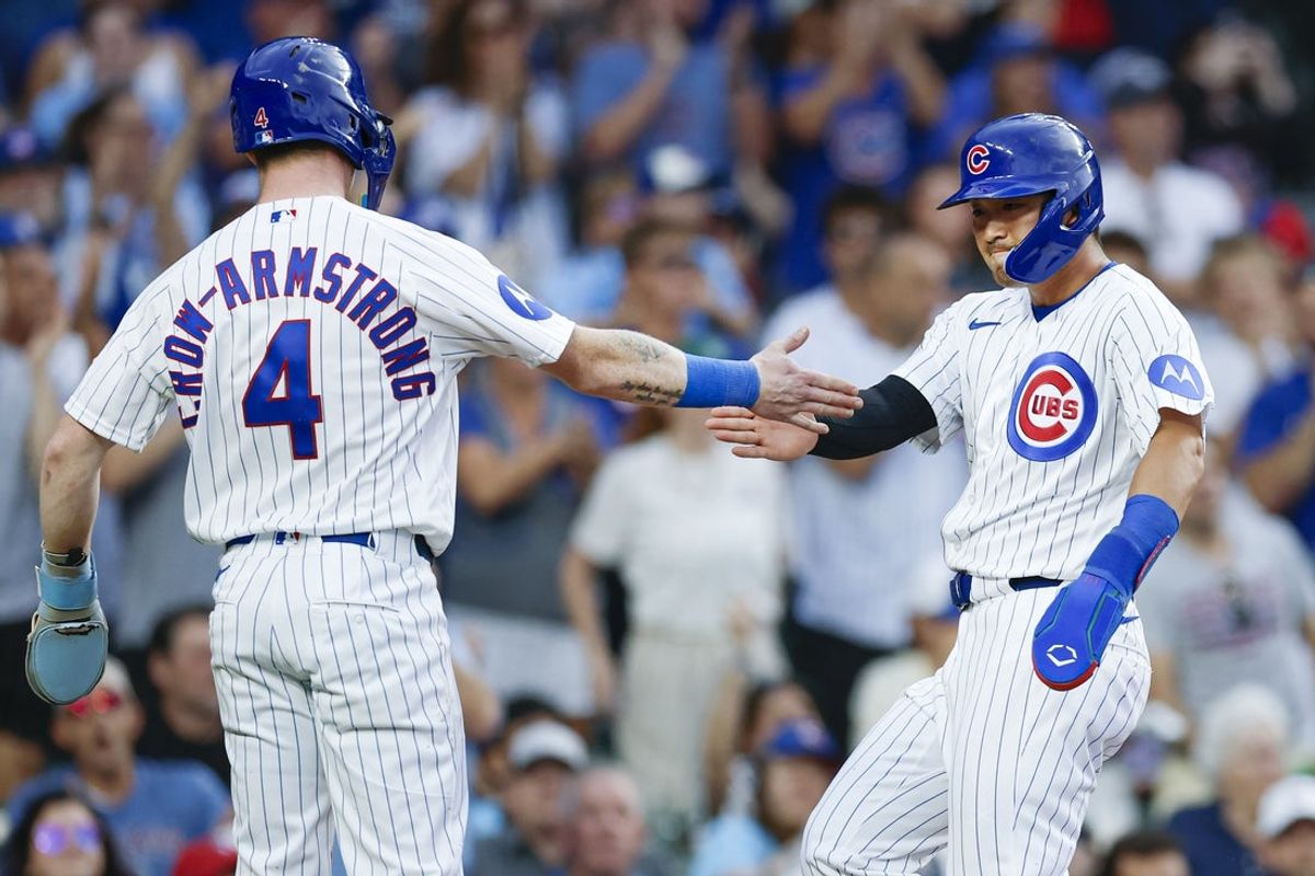 Jul 21, 2026; Chicago, Illinois, USA; Chicago Cubs center fielder Pete Crow-Armstrong (4) celebrates with right fielder Seiya Suzuki (27) after they both scored against the Detroit Tigers during the first inning at Wrigley Field. Mandatory Credit: Kamil Krzaczynski-Imagn Images