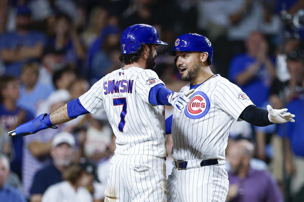 Jul 21, 2026; Chicago, Illinois, USA; Chicago Cubs designated hitter Michael Conforto (20) celebrates with shortstop Dansby Swanson (7) after hitting a two-run home run against the Detroit Tigers during the fifth inning at Wrigley Field. Mandatory Credit: Kamil Krzaczynski-Imagn Images