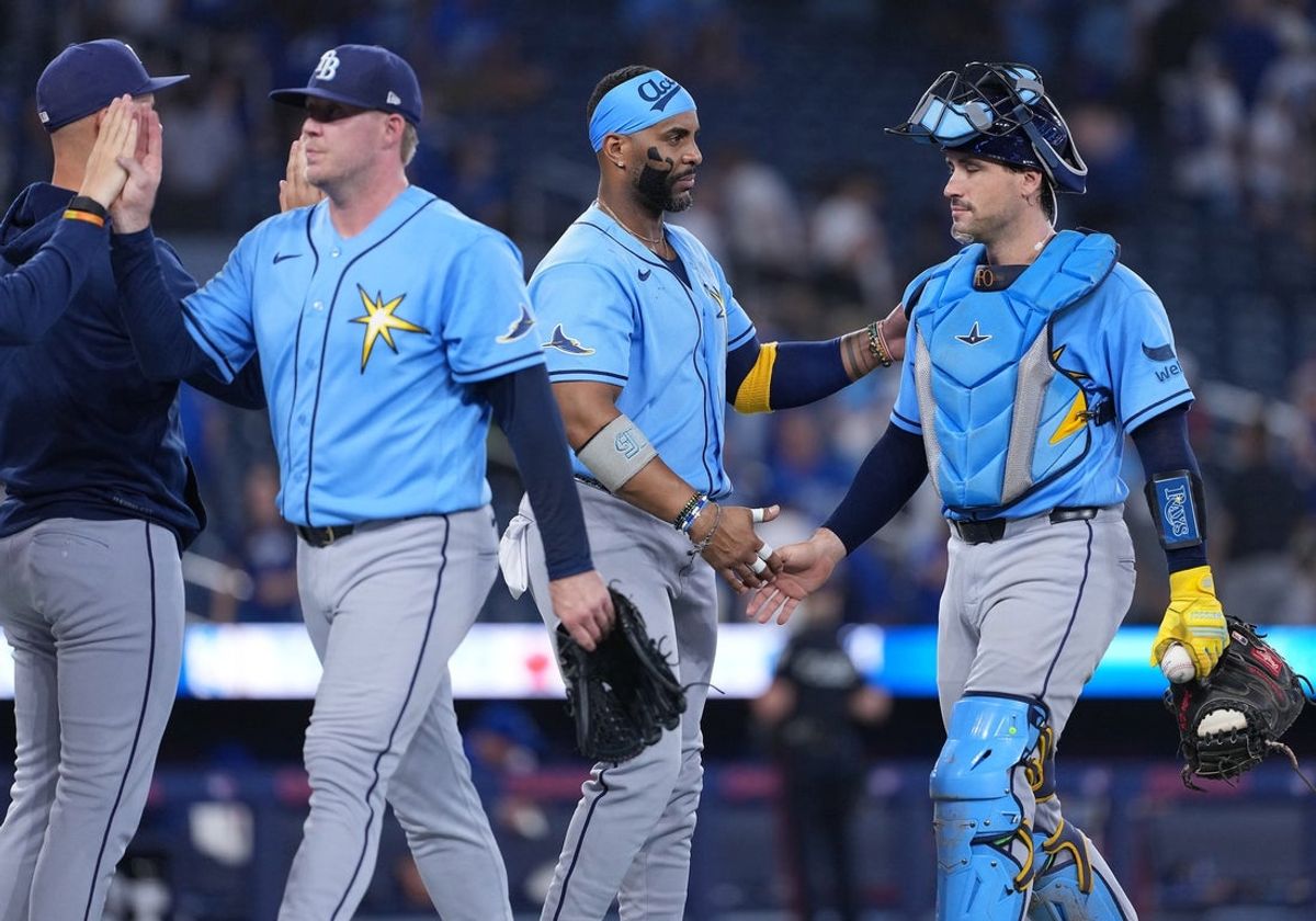 Jul 21, 2026; Toronto, Ontario, CAN; Tampa Bay Rays designated hitter Yandy Díaz (2) celebrates a win against the Toronto Blue Jays with catcher Nick Fortes (40) at Rogers Centre. Mandatory Credit: Nick Turchiaro-Imagn Images