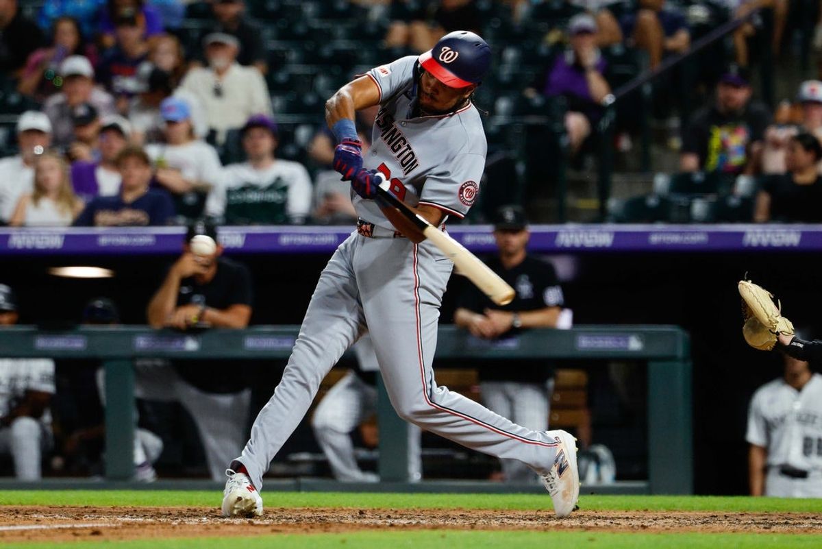 Jul 21, 2026; Denver, Colorado, USA; Washington Nationals right fielder James Wood (29) hits a double in the seventh inning against the Colorado Rockies at Coors Field. Mandatory Credit: Isaiah J. Downing-Imagn Images