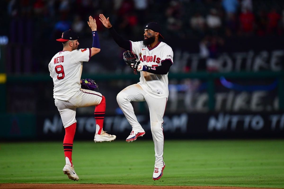 Jul 21, 2026; Anaheim, California, USA; Los Angeles Angels shortstop Zach Neto (9) and right fielder Jo Adell (7) celebrate the victory against the St. Louis Cardinals at Angel Stadium. Mandatory Credit: Gary A. Vasquez-Imagn Images