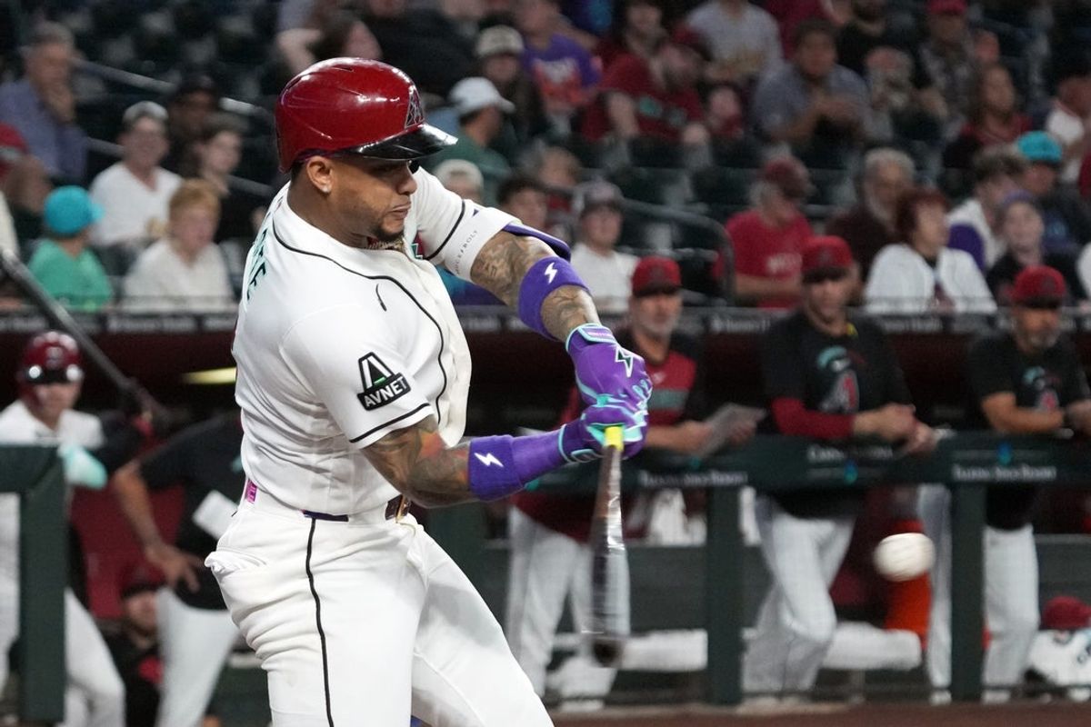 Jul 22, 2026; Phoenix, Arizona, USA; Arizona Diamondbacks second baseman Ketel Marte (4) hits a single against the Athletics in the first inning at Chase Field. Mandatory Credit: Rick Scuteri-Imagn Images
