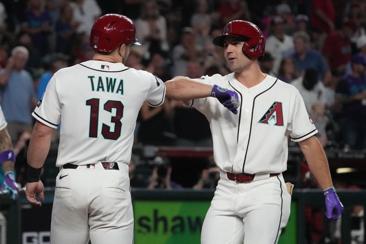 Jul 22, 2026; Phoenix, Arizona, USA; Arizona Diamondbacks center fielder Ryan Waldschmidt (15) celebrates with Tim Tawa (13) after hitting a two-run home run against the Athletics in the fifth inning at Chase Field. Mandatory Credit: Rick Scuteri-Imagn Images