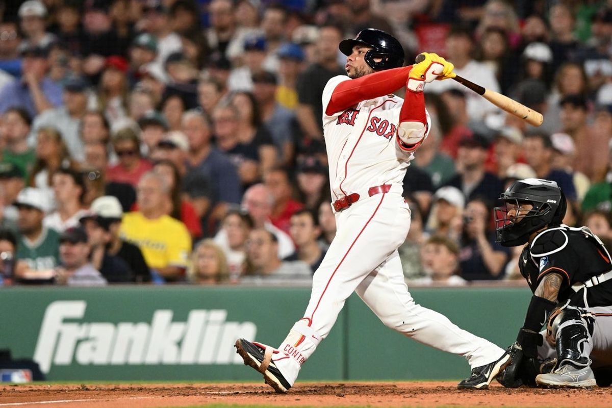 Jul 22, 2026; Boston, Massachusetts, USA; Boston Red Sox first baseman Willson Contreras (40) hits a double against the Baltimore Orioles during the fourth inning at Fenway Park. Mandatory Credit: Brian Fluharty-Imagn Images