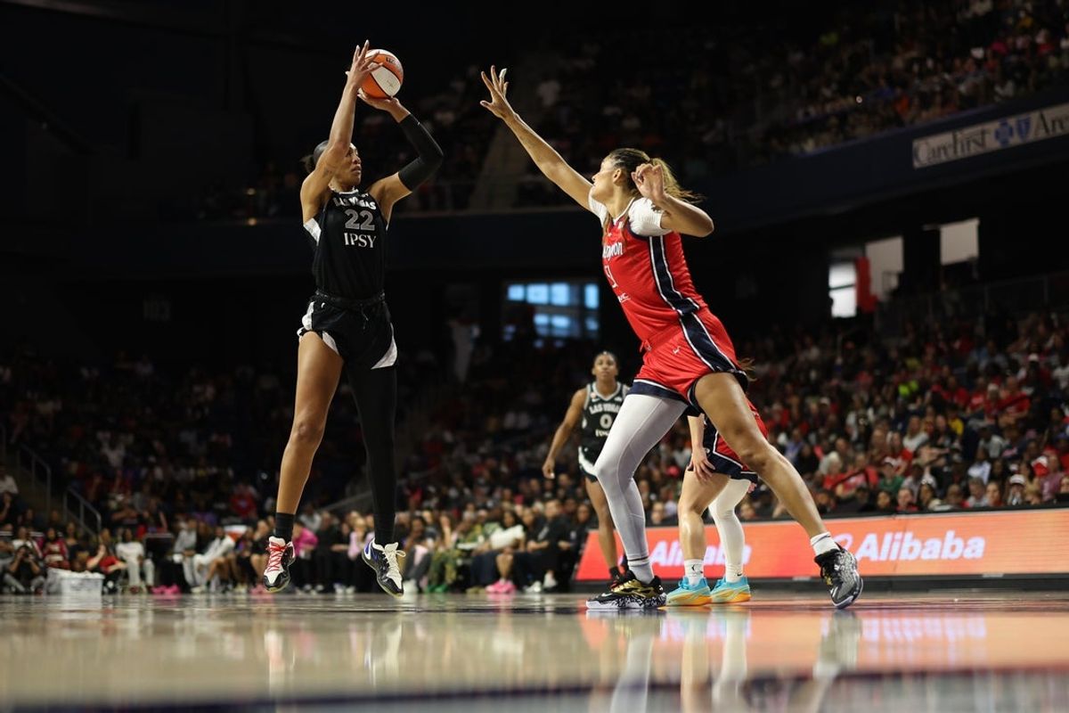 Jul 22, 2026; Washington, District of Columbia, USA; Las Vegas Aces center A'ja Wilson (22) shoots the ball as Washington Mystics center Lauren Betts (51) defends in the first half at CareFirst Arena. Mandatory Credit: Geoff Burke-Imagn Images