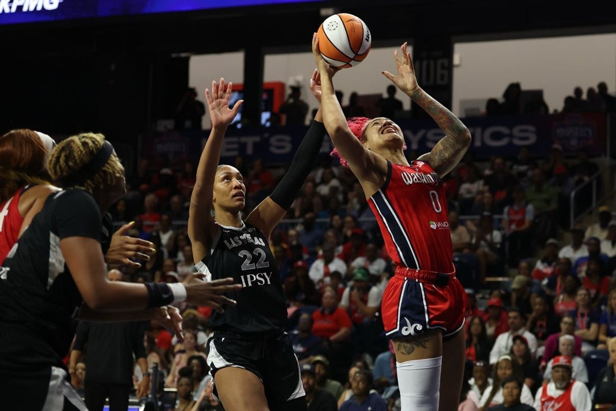 Jul 22, 2026; Washington, District of Columbia, USA; Washington Mystics center Shakira Austin (0) shoots the ball as Las Vegas Aces center A'ja Wilson (22) defends in the second half at CareFirst Arena. Mandatory Credit: Geoff Burke-Imagn Images