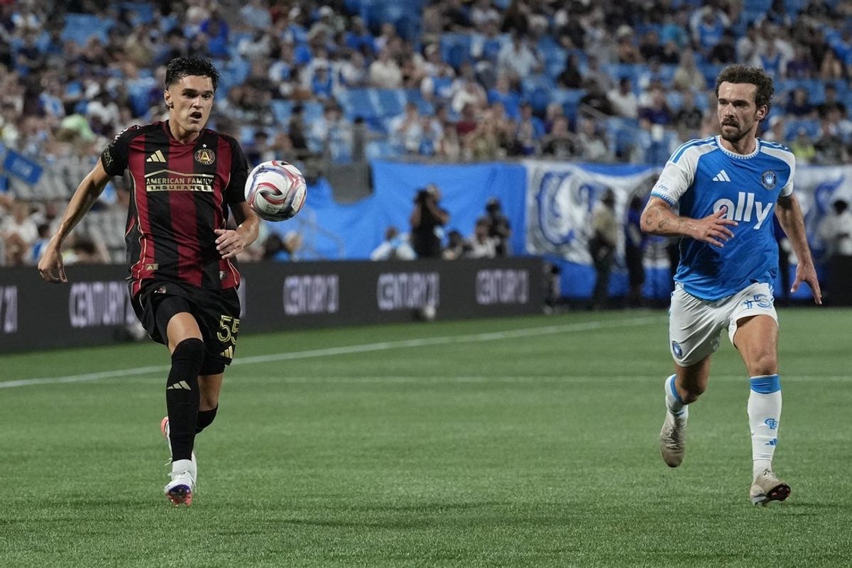 Jul 22, 2026; Charlotte, North Carolina, USA; Atlanta United defense Tomas Jacob (55) chases down the ball followed by Charlotte FC defense Harry Toffolo (15) during the second half at Bank of America Stadium. Mandatory Credit: Jim Dedmon-Imagn Images