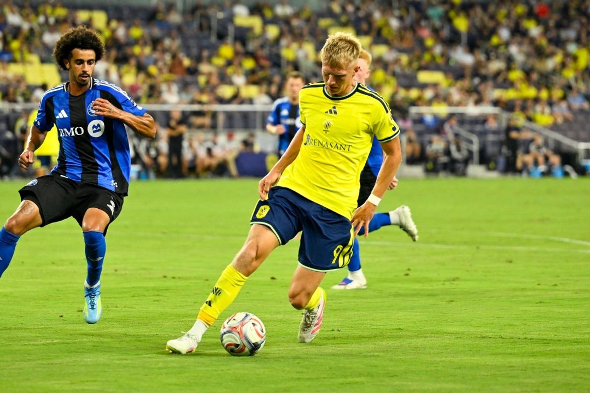 Jul 22, 2026; Nashville, Tennessee, USA;  Nashville SC forward Sam Surridge (9) dribbles the ball against the CF Montreal during the second half at Geodis Park. Mandatory Credit: Steve Roberts-Imagn Images