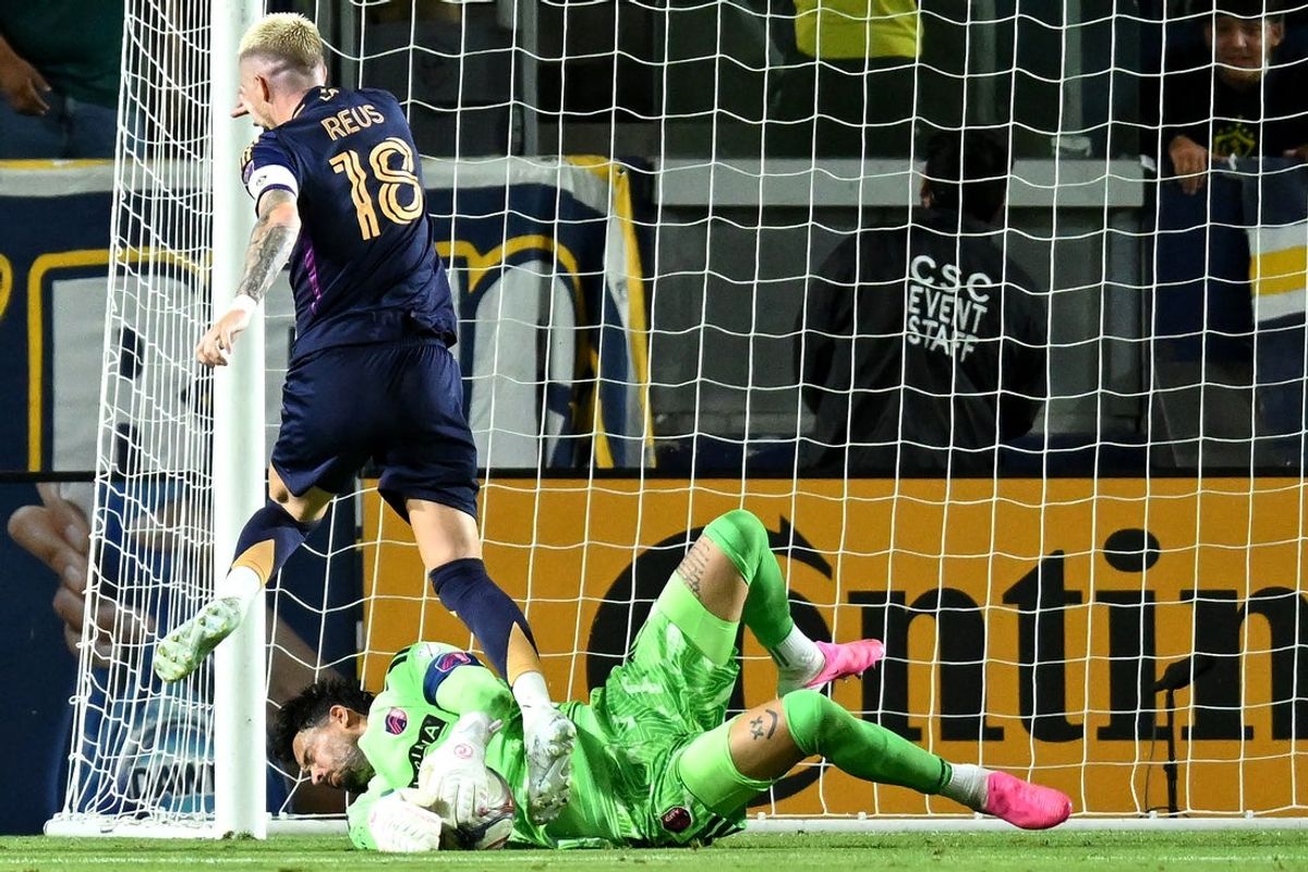 Jul 22, 2026; Carson, California, USA; St. Louis CITY SC goalkeeper Roman Burki (1) and LA Galaxy midfield Marco Reus (18) battle for the ball during the first half at Dignity Health Sports Park. Mandatory Credit: Griffin Hooper-Imagn Images