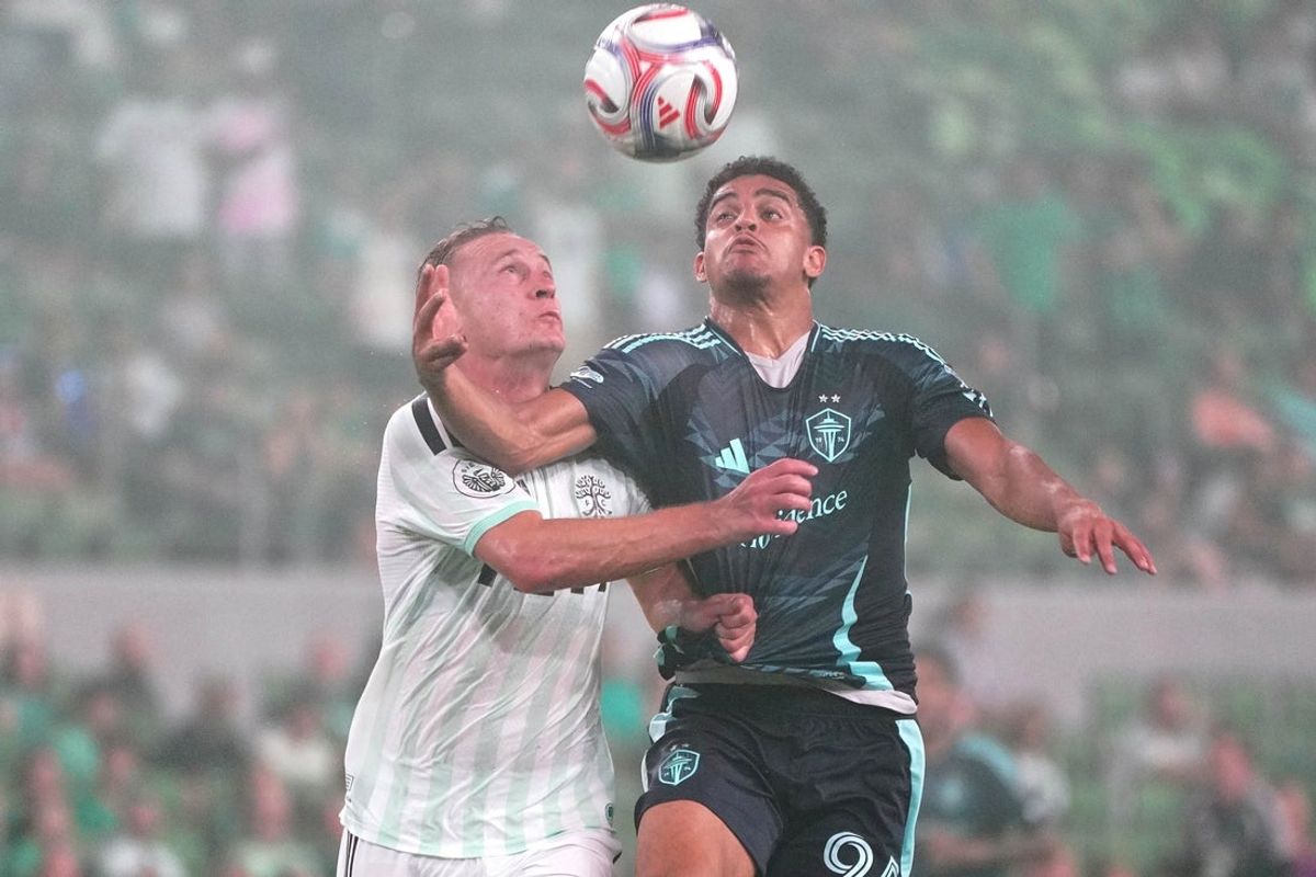Jul 22, 2026; Austin, Texas, USA; Austin FC defender Oleksandr Svatok (5) heads the ball against Seattle Sounders FC forward Osaze De Rosario (95) during the second half at Q2 Stadium. Mandatory Credit: Dustin Safranek-Imagn Images