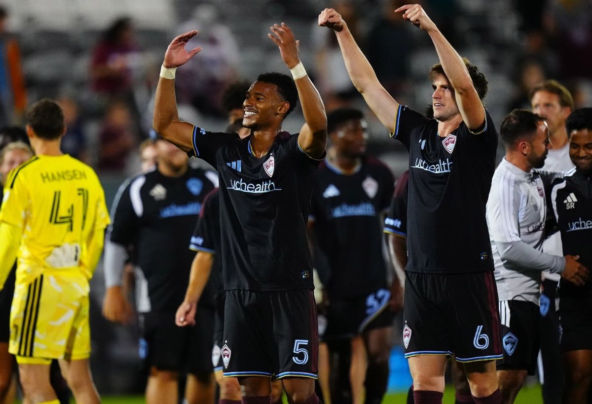 Jul 22, 2026; Commerce City, Colorado, USA;  Colorado Rapids defense Loic Williams (5) and defense Rob Holding (6) celebrate the extra time win against San Diego FC  at Dick's Sporting Goods Park. Mandatory Credit: Ron Chenoy-Imagn Images