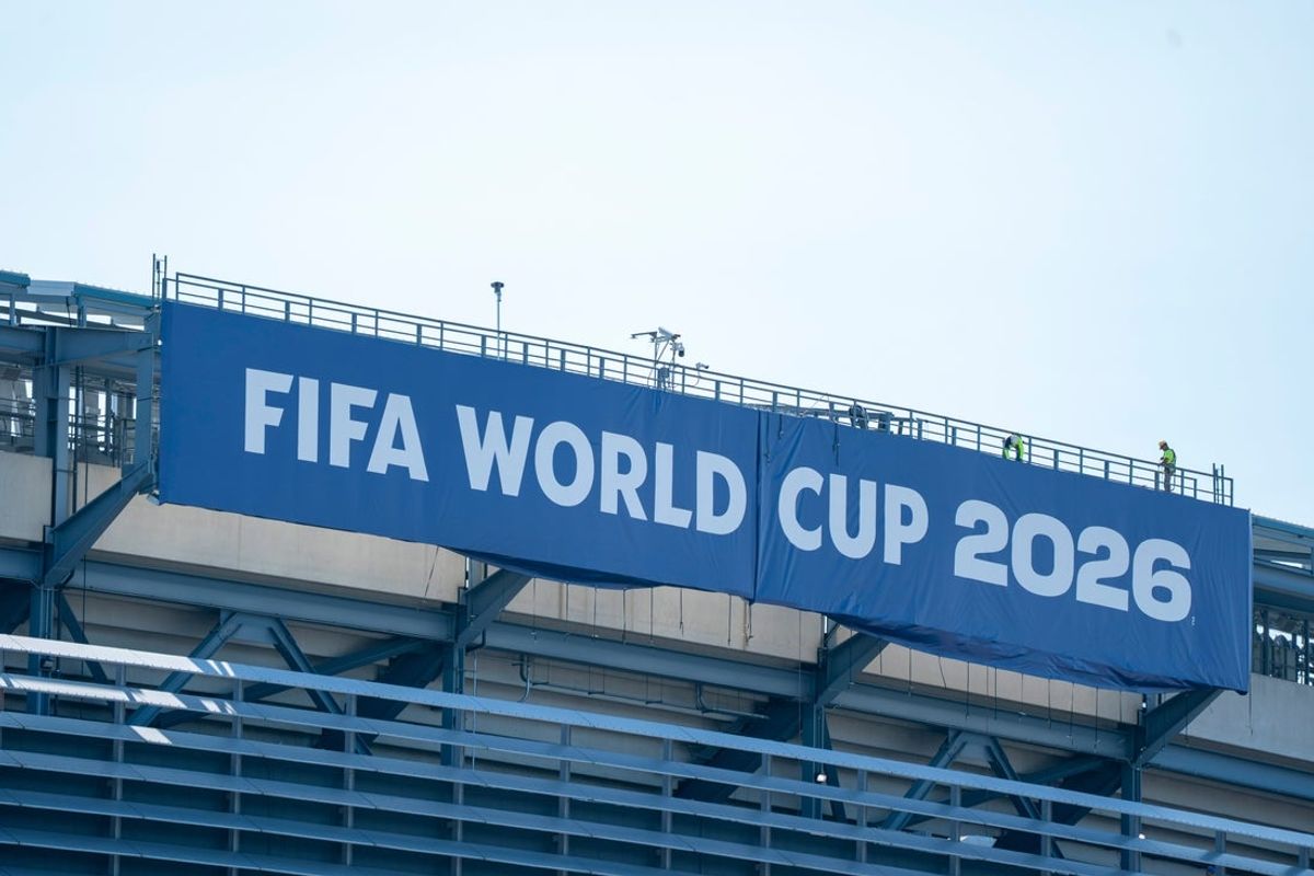 Worker remove the FIFA World Cup 2026 banner from MetLife Stadium on Thursday, July 23, 2026, in East Rutherford, NJ.