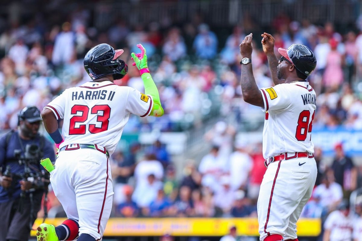 Jul 23, 2026; Cumberland, Georgia, USA; Atlanta Braves center fielder Michael Harris II (23) celebrates with Atlanta Braves third base coach Tommy Watkins (84) after hitting a home run against the San Diego Padres during the second inning at Truist Park. Mandatory Credit: Jordan Godfree-Imagn Images