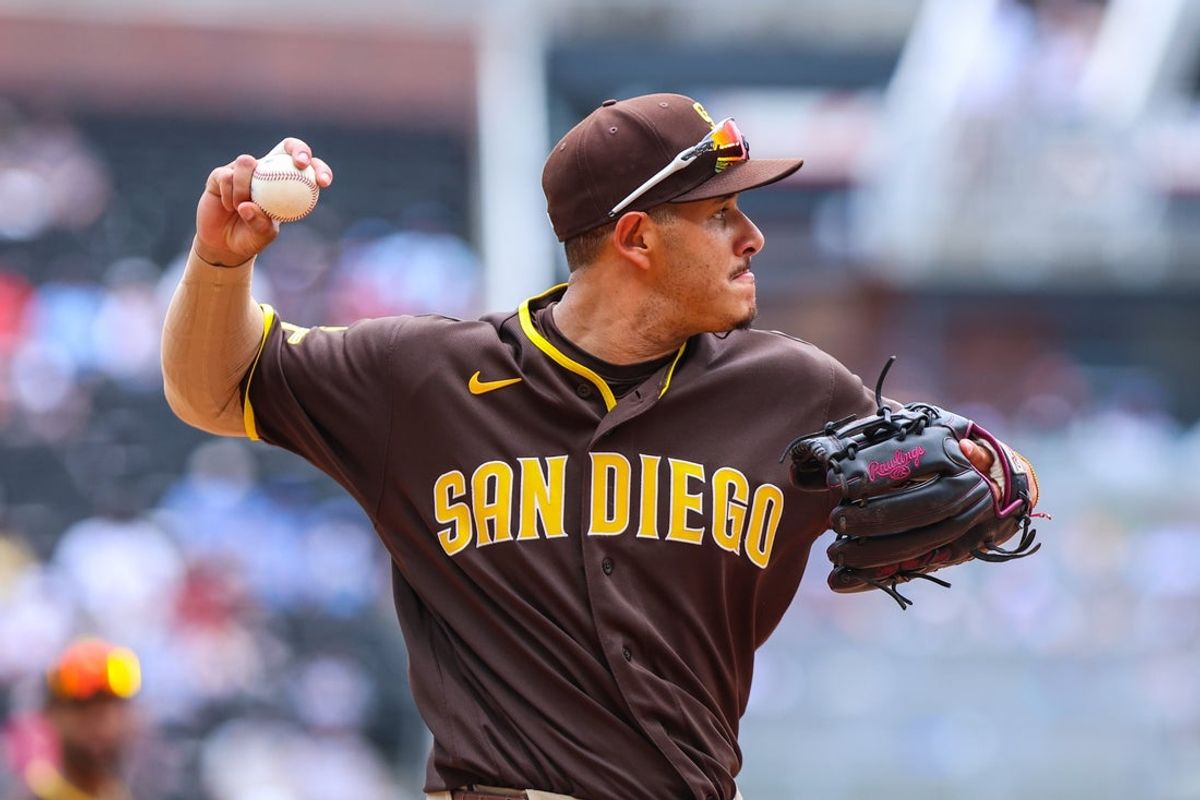 Jul 23, 2026; Cumberland, Georgia, USA; San Diego Padres third baseman Manny Machado (13) throws the ball to first base for an out against the Atlanta Braves during the eighth inning at Truist Park. Mandatory Credit: Jordan Godfree-Imagn Images