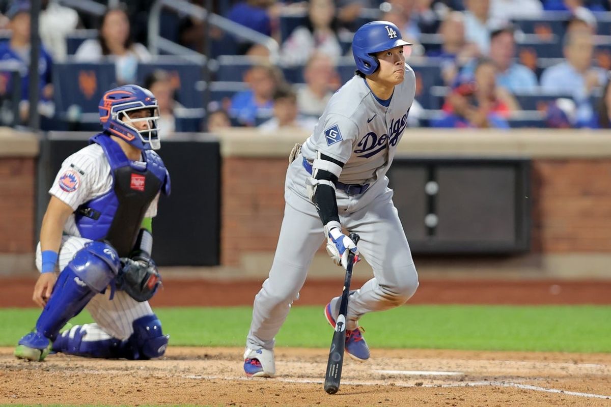 Jul 24, 2026; New York City, New York, USA; Los Angeles Dodgers designated hitter Shohei Ohtani (17) follows through on a double against the New York Mets during the fifth inning at Citi Field. Ohtani was thrown out at third base attempting to stretch the double into a triple. Mandatory Credit: Brad Penner-Imagn Images