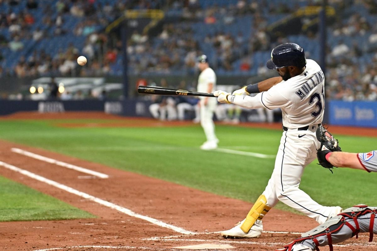 Jul 24, 2026; St. Petersburg, Florida, USA;  Tampa Bay Rays center fielder Cedric Mullins (31) hits a triple in the fourth inning against the Cleveland Guardians  at Tropicana Field. Mandatory Credit: Jonathan Dyer-Imagn Images