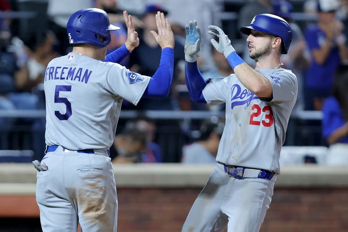 Jul 24, 2026; New York City, New York, USA; Los Angeles Dodgers right fielder Kyle Tucker (23) celebrates his two run home run against the New York Mets with first baseman Freddie Freeman (5) during the eighth inning at Citi Field. Mandatory Credit: Brad Penner-Imagn Images