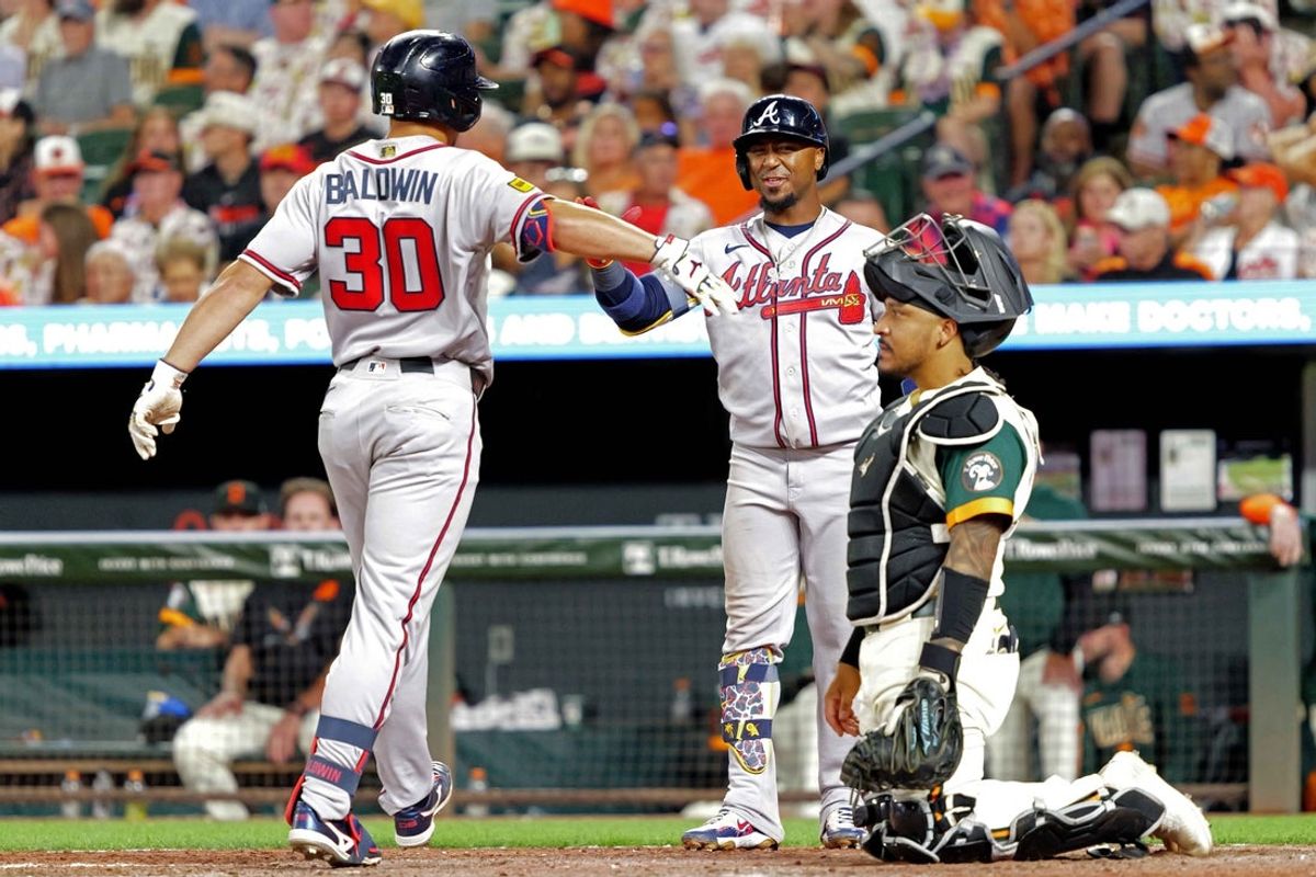 Jul 24, 2026; Baltimore, Maryland, USA; Atlanta Braves designated hitter Drake Baldwin (30 greeted by second baseman Ozzie Albies (2) following his solo home run in the eighth inning against the Baltimore Orioles at Oriole Park at Camden Yards. Mandatory Credit: Mitch Stringer-Imagn Images