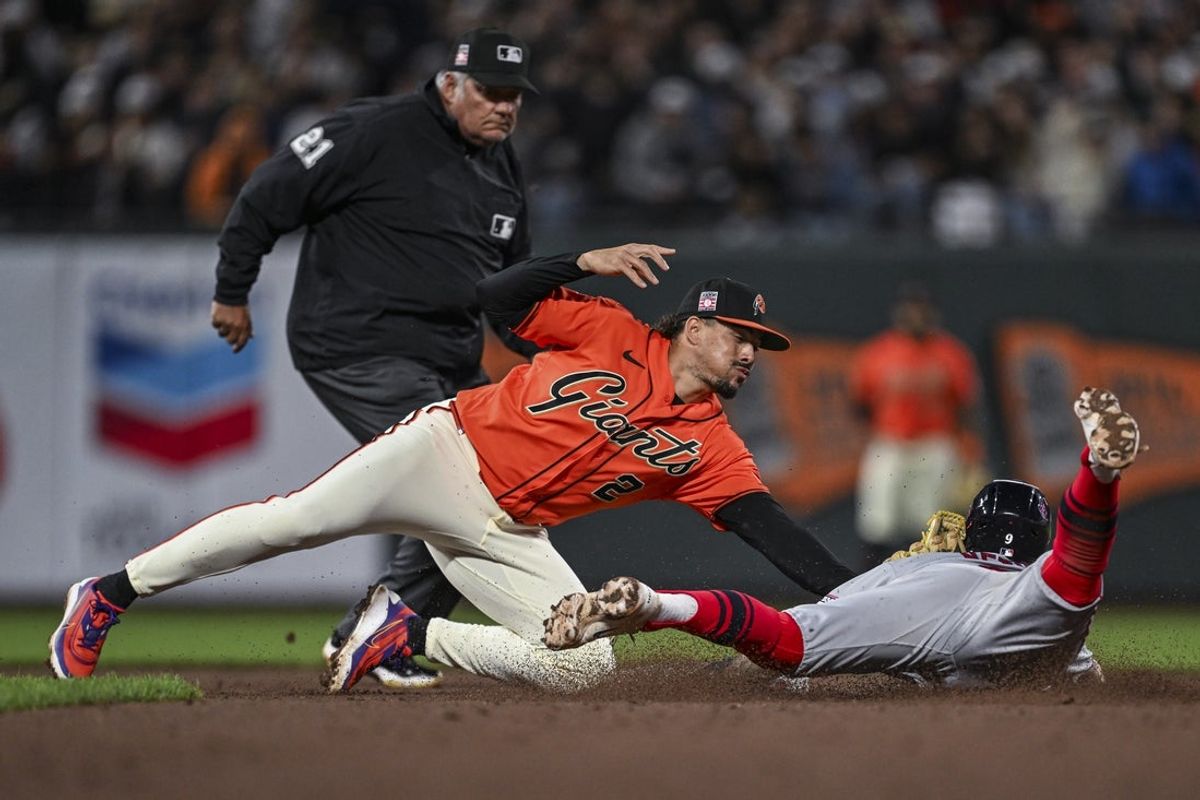 Jul 24, 2026; San Francisco, California, USA; San Francisco Giants shortstop Willy Adames (2) tags out Los Angeles Angels shortstop Zach Neto (9) who tries to steal second base in the top of the fifth inning at Oracle Park. Mandatory Credit: Justine Willard-Imagn Images