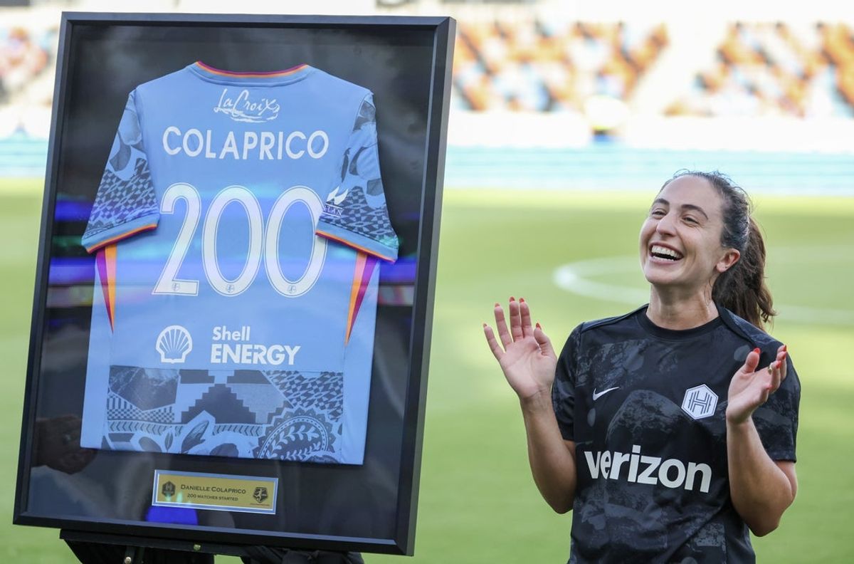 Jul 24, 2026; Houston, Texas, USA;  Before playing against the Bay FC Houston Dash midfielder Danielle Colaprico (24) is recognized for playing in her 200th NWSL game at Shell Energy Stadium. Mandatory Credit: Thomas Shea-Imagn Images