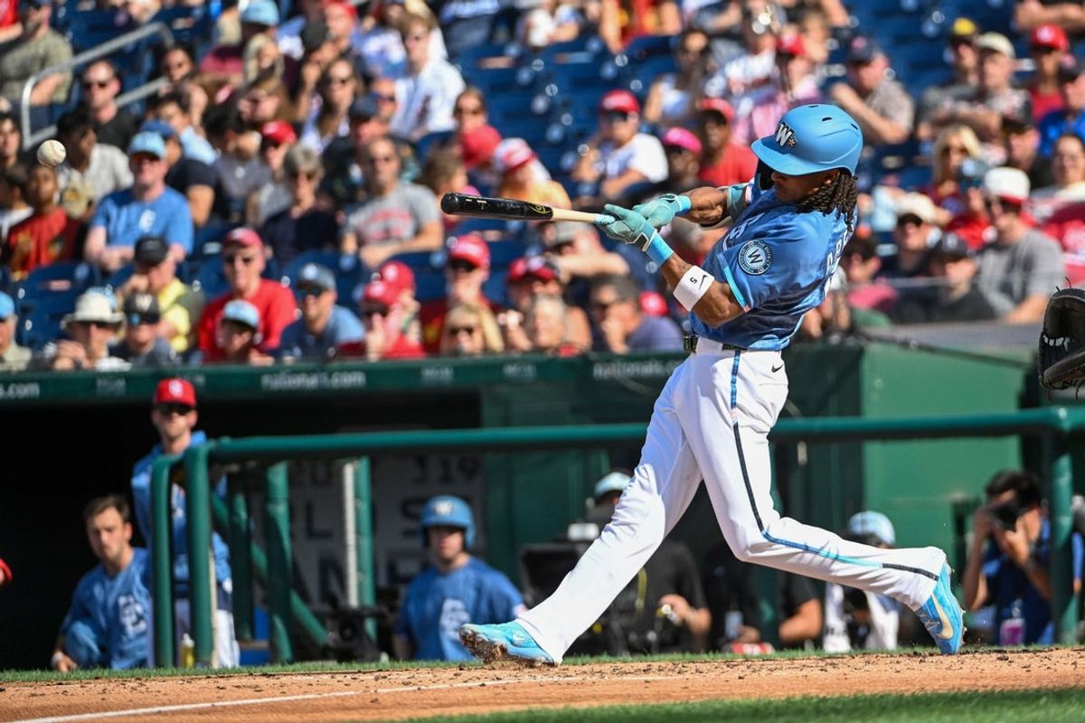 Jul 25, 2026; Washington, District of Columbia, USA; Washington Nationals shortstop CJ Abrams (5) hits a two RBI double against the Arizona Diamondbacks during the third inning at Nationals Park. Mandatory Credit: Brad Mills-Imagn Images
