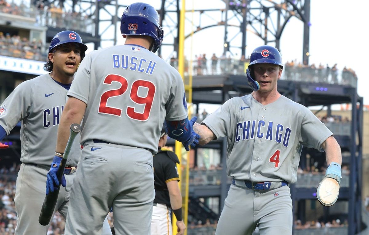 Jul 25, 2026; Pittsburgh, Pennsylvania, USA; Chicago Cubs first baseman Michael Busch (29) greets catcher Miguel Amaya (left) and center fielder Pete Crow-Armstrong (4) at home plate after both players scored runs against the Pittsburgh Pirates during the fifth inning at PNC Park. Mandatory Credit: Charles LeClaire-Imagn Images