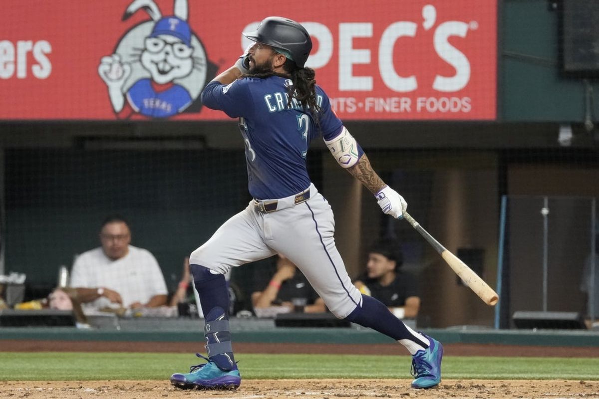 Jul 25, 2026; Arlington, Texas, USA; Seattle Mariners third baseman J.P. Crawford (3) follows through on his single against the Texas Rangers during the third inning at Globe Life Field. Mandatory Credit: Jim Cowsert-Imagn Images