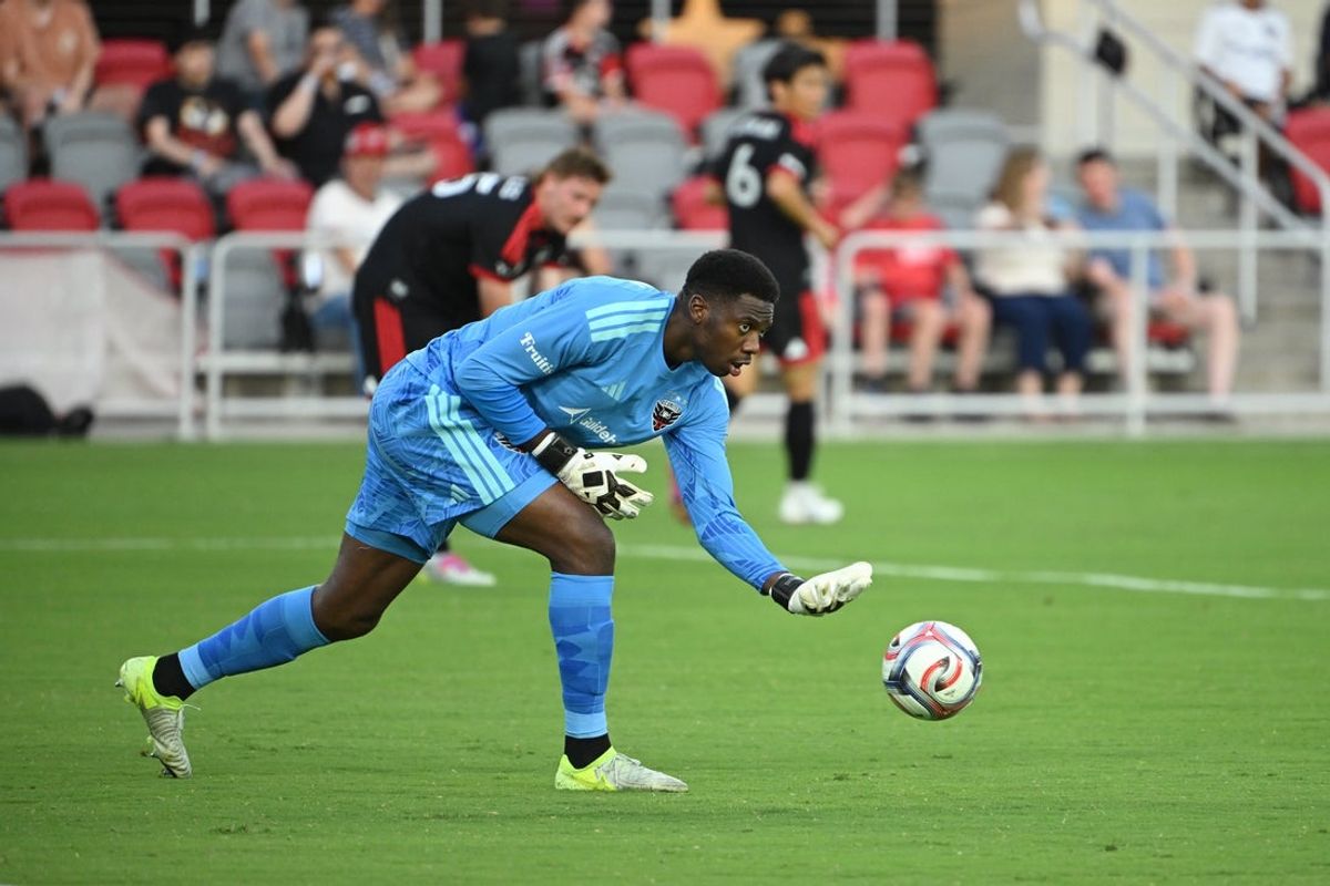 Jul 25, 2026; Washington, District of Columbia, USA; D.C. United goalkeeper Sean Johnson (1) plays the ball against the Toronto FC during the first half at Audi Field. Mandatory Credit: Rafael Suanes-Imagn Images