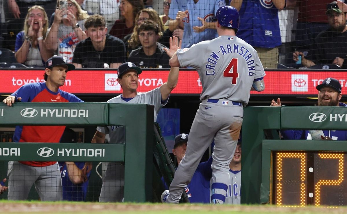 Jul 25, 2026; Pittsburgh, Pennsylvania, USA;  Chicago Cubs manager Craig Counsell (middle) greets center fielder Pete Crow-Armstrong (4) returning to the dugout after hitting a two-run home run against the Pittsburgh Pirates during the seventh inning at PNC Park. Mandatory Credit: Charles LeClaire-Imagn Images
