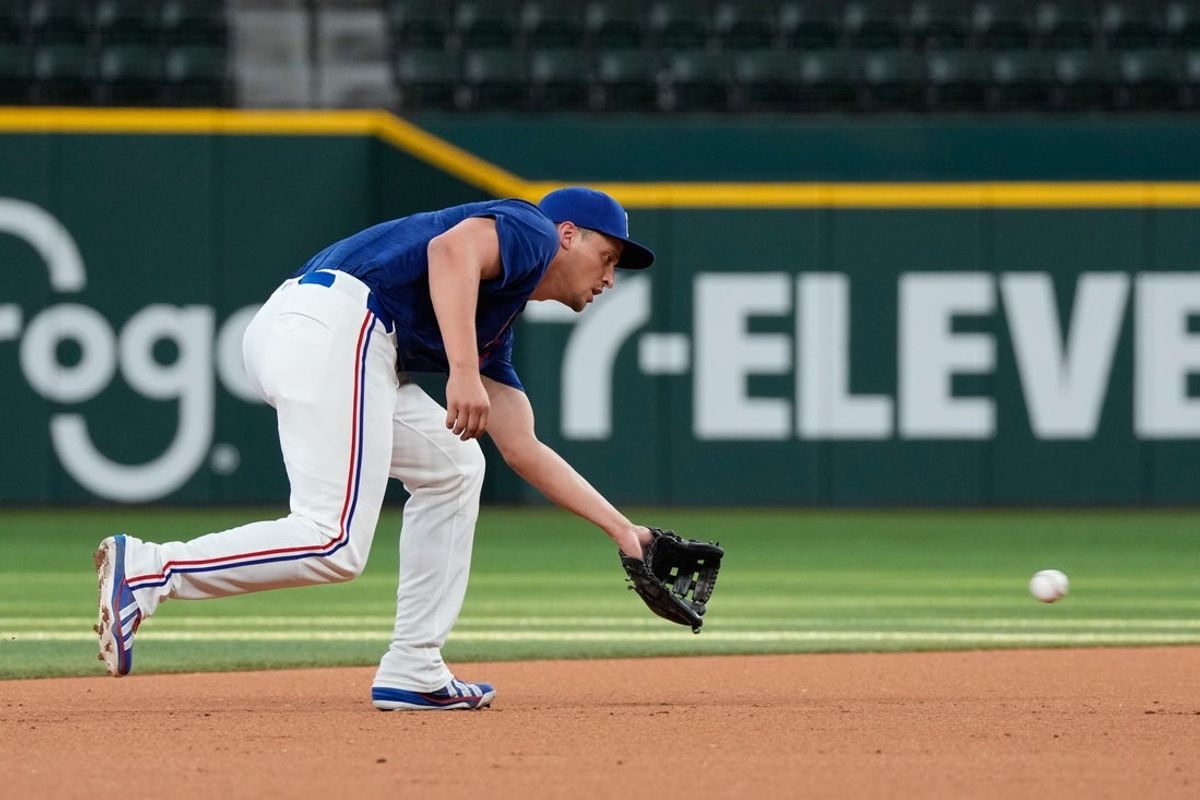 Jul 26, 2026; Arlington, Texas, USA; Texas Rangers short stop Corey Seager takes fielding practice before the game against the Seattle Mariners at Globe Life Field. Mandatory Credit: Jim Cowsert-Imagn Images