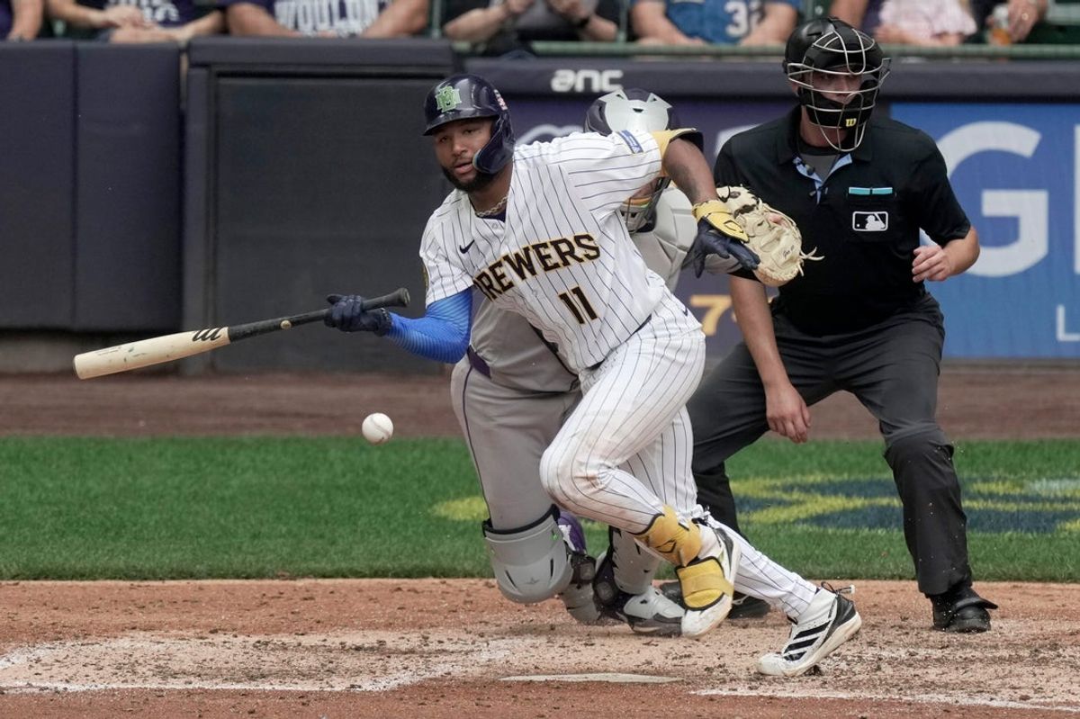 Milwaukee Brewers left fielder Jackson Chourio (11) hits a ground ball RBI during the sixth inning of their game against the Colorado Rockies Sunday, July 26, 2026 at American Family Field in Milwaukee, Wisconsin.